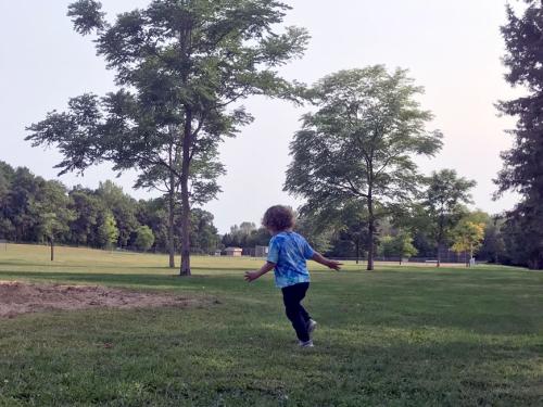 kid runs in park