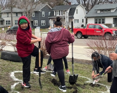 Students digging a garden