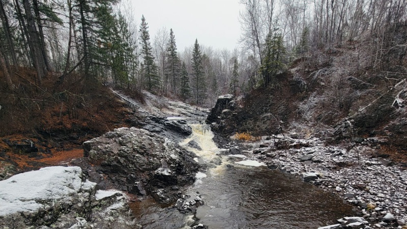 Stream flows through Lester Park in Duluth in winter