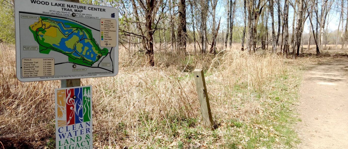 Legacy Amendment signage near path and trees