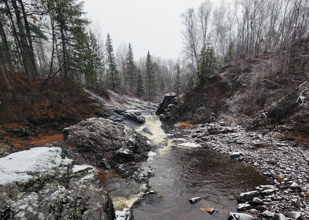 Stream flows through Lester Park in Duluth in winter